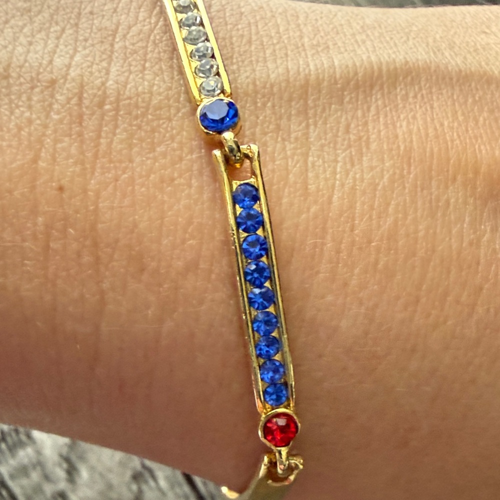 Elegant Gold Bracelet with Red, Blue, and White Accents - Picture 6 of 8